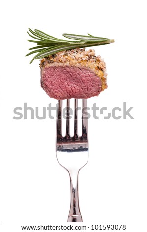 White isolated saddle of lamb with thyme on a fork