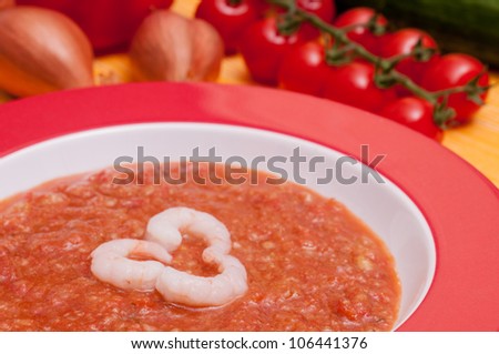 Close up of a spanish cold vegetable soup gazpacho with shrimps