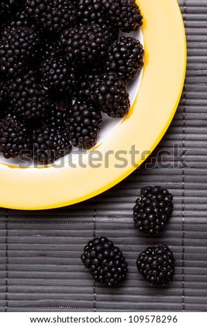 Close up of black blackberries in vertical format