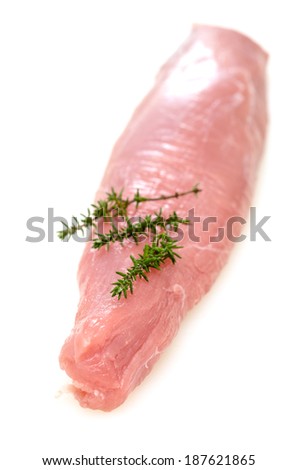 Raw pork fillet with thyme in vertical format