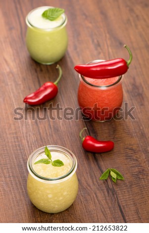 Chilled fruit soups with mint and jalapeno chili in vertical format