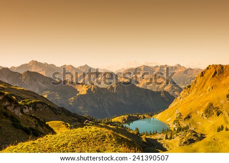 Mountains and lake in the alps with text space