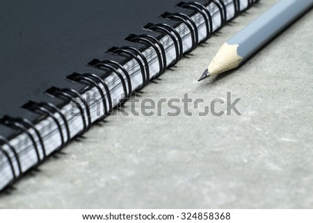 notebook paper ridge coil type for account book and take note and pencil.
