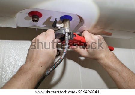Water heater repair: turning soft iron pipes with pipe wrench
