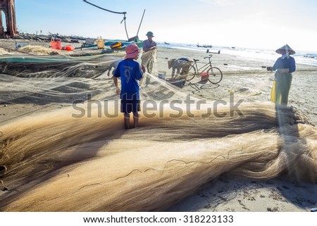 Coastal Plain, Vietnam, Aug 2014: Daily life of Fishermen on the sea, they work very hard and they are poor
