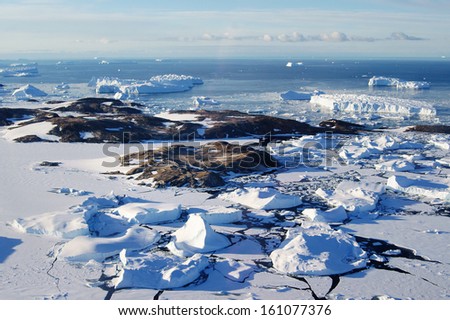 Antarctic from the airplane. Bird\'s eye view of the icebergs