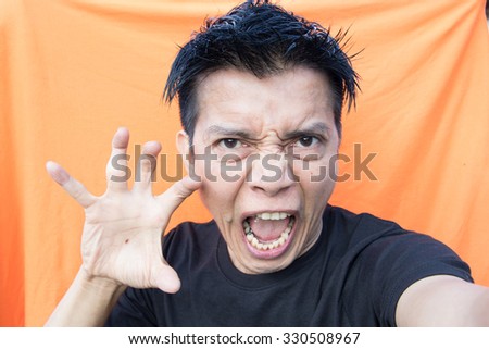 Thai Asian man's emotional expression.Angry, angry,