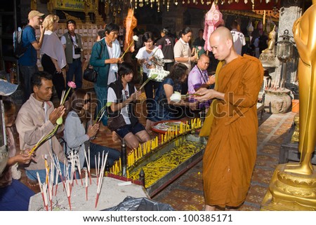 CHIANG MAI, THAILAND - NOVEMBER 11:Thai people are praying for a religious ceremony in the Doi Suthep temple during the Loy Krathong festival in Chiang Mai, Thailand on November 11, 2011