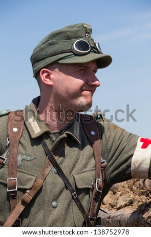 KIEV, UKRAINE -MAY 11: Member of Red Star history club wears historical German uniform during historical reenactment of WWII, May 11, 2013 in Kiev, Ukraine
