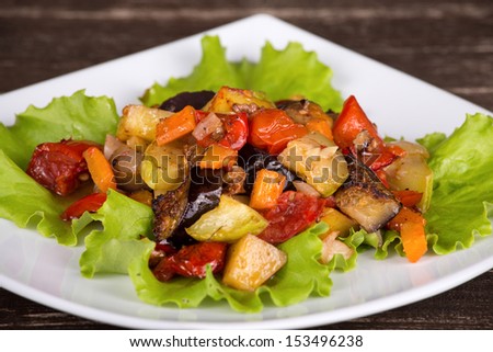 Roasted vegetables on a white plate, close up