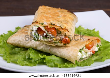 Cottage cheese and vegetables wrapped in pita bread