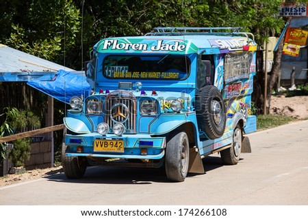 EL NIDO, PHILIPPINES - JANUARY 29, 2014 :Jeepneys passing, Philippines inexpensive bus service. Jeepneys are the most popular means of public transportation in the Philippines.