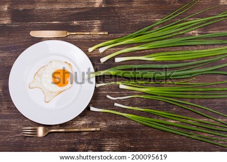 Egg , chives, plate, knife and fork look like sperm competition, Spermatozoons floating to ovule