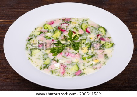 Close up of russian cold vegetable soup on yogurt (sour-milk) base - okroshka