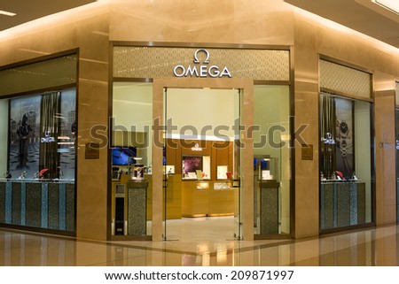 BANGKOK,THAILAND - NOVEMBER 19, 2013 : Front view of OMEGA store in Siam Paragon Mall in Bangkok. With 300,000 sq m of retail space Siam Paragon is one of the world\'s largest malls.