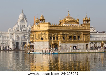 AMRITSAR, INDIA - SEPTEMBER 27, 2014: Unidentified Sikhs and indian people visiting the Golden Temple in Amritsar, Punjab, India. Sikh pilgrims travel from all over India to pray at this holy site.