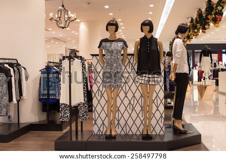 BANGKOK,THAILAND - NOVEMBER 19, 2013 : Women\'s clothing section in supermarket Siam Paragon. Siam Paragon is a one of the biggest shopping centres in Asia.