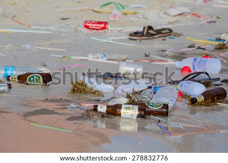 KOH PHANGAN,THAILAND - DECEMBER 7, 2014: Consequences of sea water pollution on the Haad Rin beach after the full moon party.