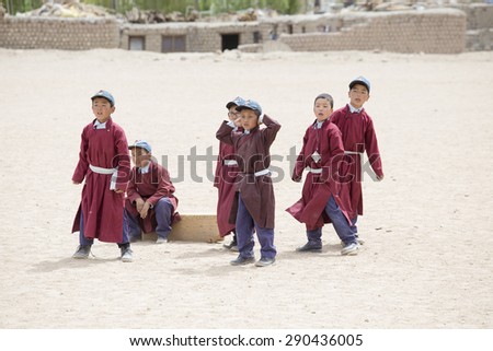 LEH, INDIA - JUNE 24, 2015: Unidentified Tibetan students in a lesson on Sport in Shey Druk White Lotus School