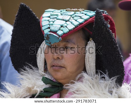 HEMIS, INDIA - JUNE 27, 2015: Unidentified tibetan buddhist woman in national dress during Hemis Festival at Ladakh, North India