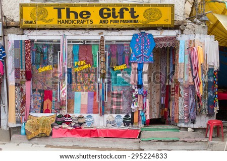 LEH, INDIA - JUNE 29, 2015 : Front view of Tibetan shop clothes and souvenirs outside the tourist town of Leh, India
