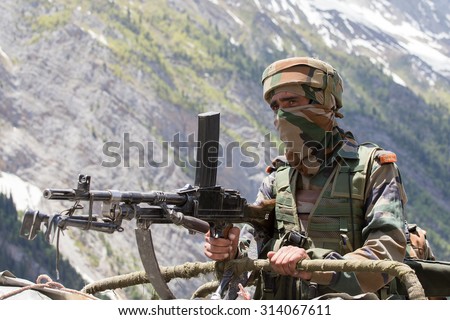 JAMMU AND KASHMIR, INDIA - JUNE 12, 2015 : Unknown Indian frontier guard. Indian Army checkpoint in Kashmir Himalayas. Kashmir became dangerous again.