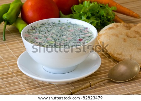 Close-up of russian cold vegetable soup on yogurt (sour-milk) base - okroshka
