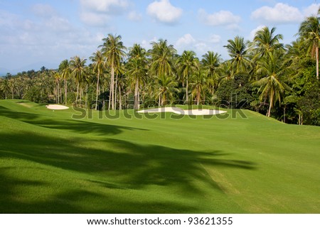 Landscape of a beautiful green golf course with sky. Island Koh Samui, Thailand.
