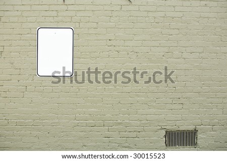 brick wall with blank sign