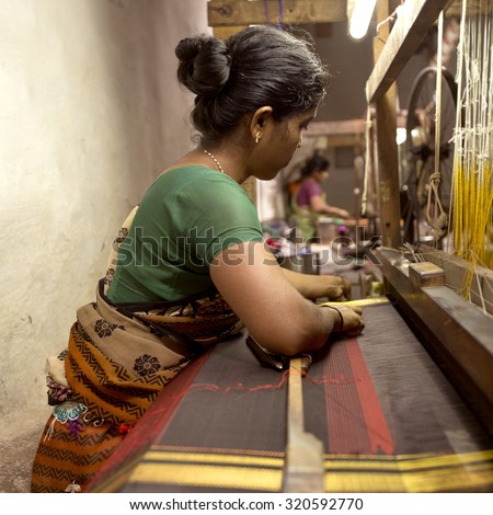 URAVAKONDA,INDIA-CIRCA 2014 - An unidentified lady weaving a silk saree in Uravakonda