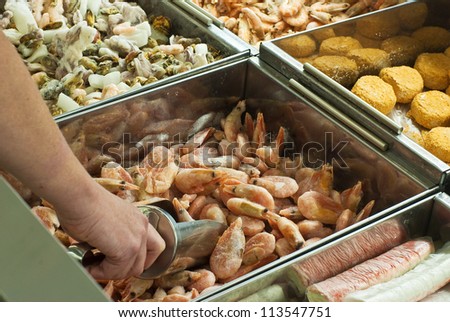 Buying frozen shrimps in  supermarket