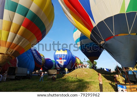 VELIKIE LUKI, RUSSIAN FEDERATION-JUNE 12: Pilots prepare for mass-start at the opening of the XVI-th International Balloon Meet June 12, 2011 in Velikie Luki, RUSSIAN FEDERATION.