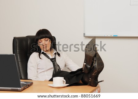 Young businessman sleeps in the office