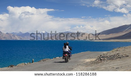 two persons on a motorbike near Pangong lake