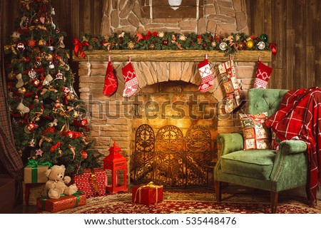 Christmas interior room fireplace, Christmas tree, green chair with a red blanket and gifts
