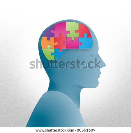 Human head silhouette with brain shaped puzzle