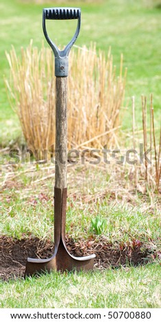 A shovel awaits the gardener for Spring clean up.