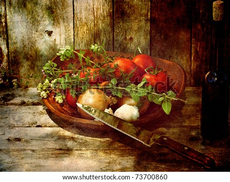 Fresh vegetables, a knife and wine on wood, antique textured.