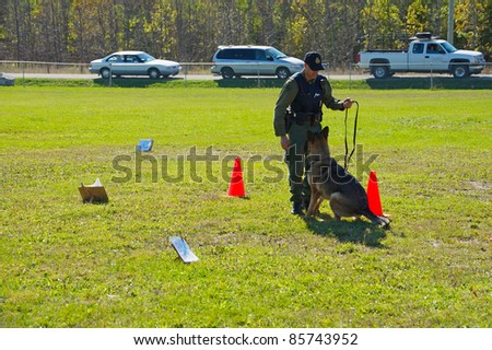 KAGAWONG, ONTARIO, CANADA -OCTOBER 1: Police dog demonstration showing drug sniffing and attack training on October 1, 2011 in Kagawong, on Manitoulin Island, Ontario Canada.