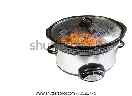 Crock pot  with delicious home made chili simmering, isolated on white with copy space.