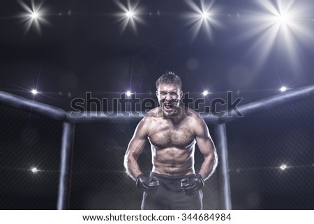 fighter in a mixed fight cage in rage shouting loud