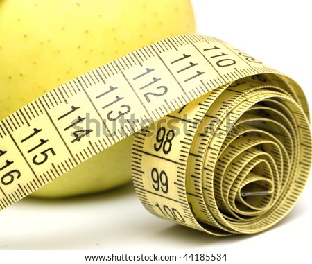 yellow apple and measuring tape, isolated on white