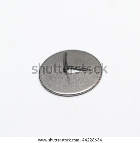 macro picture of metal drawing - pin over white background