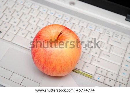 red apple over grey laptop