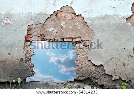 blue sky hole in aged brick wall background