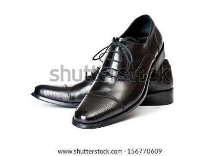 Close-up of elegant mens shoes on white background Close-up of elegant mens shoes on white background
