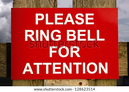 Red and white ring bell for attention sign