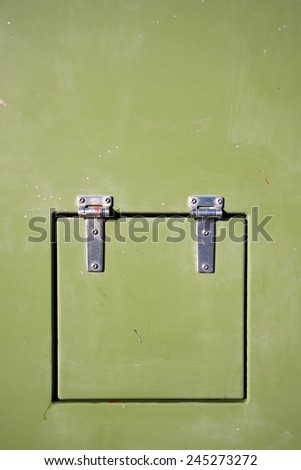 Green metal container with hinged door