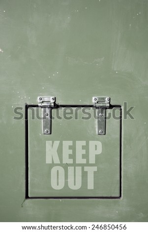 Green metal container with hinged door, keep out