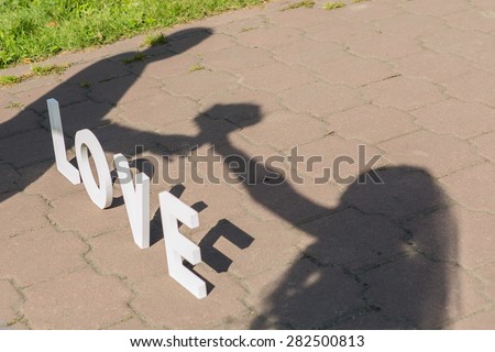 Shadows of love letters and just married couple